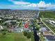 Aerial view of a house and its surrounding neighborhood, near Tampa Bay at 519 Treviso Dr, Apollo Beach, FL 33572