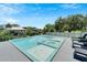 Modern rectangular pool with integrated spa and lounge chairs at 519 Treviso Dr, Apollo Beach, FL 33572