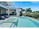 Stunning pool and spa with outdoor kitchen and lounge area at 519 Treviso Dr, Apollo Beach, FL 33572