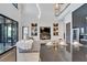 Modern living room features a large sectional sofa, fireplace, and built-in shelving at 519 Treviso Dr, Apollo Beach, FL 33572