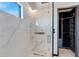 Spa-like shower with marble surround and rainfall shower head at 519 Treviso Dr, Apollo Beach, FL 33572