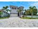 Two-story house with gray stone driveway and landscaping at 519 Treviso Dr, Apollo Beach, FL 33572