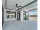 Covered balcony with marble floors and access to the outdoors at 519 Treviso Dr, Apollo Beach, FL 33572