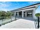 Spacious balcony with marble flooring and glass railings, offering stunning views at 519 Treviso Dr, Apollo Beach, FL 33572