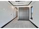 Spacious hallway with grey carpeting and modern doors at 519 Treviso Dr, Apollo Beach, FL 33572