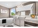 Elegant bathroom featuring a soaking tub, vanity with makeup area, and modern fixtures at 33346 Kateland Dr, Wesley Chapel, FL 33545