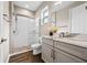 Bathroom with a double vanity, stone countertop, and modern glass shower stall with river rock shower floor at 33346 Kateland Dr, Wesley Chapel, FL 33545