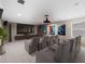 Cozy home theater featuring comfortable seating, a large screen, and state-of-the-art sound system at 33346 Kateland Dr, Wesley Chapel, FL 33545