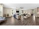 Spacious living room with tile flooring, fireplace, ceiling fan, and plenty of seating at 33346 Kateland Dr, Wesley Chapel, FL 33545