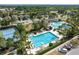 Community swimming pool with lap lanes, lounge area, and tennis court at 33346 Kateland Dr, Wesley Chapel, FL 33545