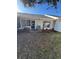 Backyard with AC unit and small landscaped area at 381 Gloucester St # 381, Safety Harbor, FL 34695