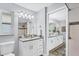Modern bathroom with white vanity and grey countertop at 4302 Deepwater Ln, Tampa, FL 33615