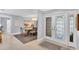 Elegant dining room adjacent to the entryway, featuring a large table and chandelier at 4302 Deepwater Ln, Tampa, FL 33615