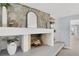 Modern fireplace with stone surround and built-in shelving at 4302 Deepwater Ln, Tampa, FL 33615