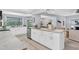 Modern kitchen with white cabinets, granite countertops, and stainless steel appliances at 4302 Deepwater Ln, Tampa, FL 33615