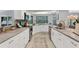 Renovated kitchen featuring white cabinets, granite countertops, and a spacious layout at 4302 Deepwater Ln, Tampa, FL 33615