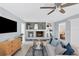 Living room featuring a stone fireplace and hardwood floors at 4302 Deepwater Ln, Tampa, FL 33615