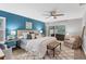 Spacious main bedroom with a king-size bed and blue accent wall at 4302 Deepwater Ln, Tampa, FL 33615