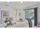 Bright office space with two armchairs, a sliding glass door leading to a patio, and plenty of natural light at 4302 Deepwater Ln, Tampa, FL 33615