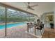 Inviting pool area with a covered patio, dining table, and a relaxing atmosphere at 4302 Deepwater Ln, Tampa, FL 33615