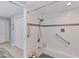 Large walk-in shower with built-in seat and grab bars at 4302 Deepwater Ln, Tampa, FL 33615