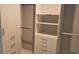 Large walk-in closet with shelves, drawers, and hanging rods at 4302 Deepwater Ln, Tampa, FL 33615
