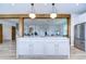 Large kitchen island with white cabinets and marble countertop at 20131 Nob Oak Ave, Tampa, FL 33647