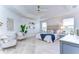Main bedroom with seating area and ceiling fan at 20131 Nob Oak Ave, Tampa, FL 33647