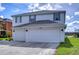 Two-story house with a two-car garage and a landscaped yard at 20131 Nob Oak Ave, Tampa, FL 33647