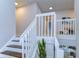 White railing staircase leading to upper floor loft area at 20131 Nob Oak Ave, Tampa, FL 33647