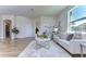 Light and airy living room with large windows and beige sofa at 20131 Nob Oak Ave, Tampa, FL 33647