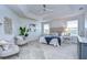 Large main bedroom with ceiling fan and sitting area at 20131 Nob Oak Ave, Tampa, FL 33647