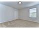 Well-lit bedroom with neutral walls, carpet flooring, and a window with blinds at 20131 Nob Oak Ave, Tampa, FL 33647