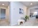 Spacious hallway with bench, artwork, and access to bedrooms at 20131 Nob Oak Ave, Tampa, FL 33647