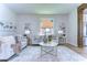 Open living room with light walls, wood floors, and a beige sofa at 20131 Nob Oak Ave, Tampa, FL 33647
