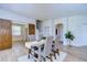 Bright dining area with rustic wooden table and modern chairs at 20131 Nob Oak Ave, Tampa, FL 33647