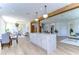 Large kitchen island with marble countertop and white cabinets at 20131 Nob Oak Ave, Tampa, FL 33647