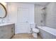 Updated bathroom with gray tile, a vanity, and a bathtub at 20131 Nob Oak Ave, Tampa, FL 33647