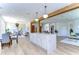 Large kitchen island with marble countertop and white cabinets at 20131 Nob Oak Ave, Tampa, FL 33647