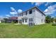 Two-story house with a large backyard and screened patio at 20131 Nob Oak Ave, Tampa, FL 33647