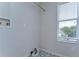 Bright laundry room with tile floor and window at 20131 Nob Oak Ave, Tampa, FL 33647