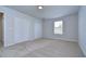 Spacious bedroom with neutral walls, carpet flooring and double door closet at 20131 Nob Oak Ave, Tampa, FL 33647