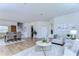Open concept living room and dining area with light floors at 20131 Nob Oak Ave, Tampa, FL 33647
