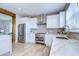 Modern kitchen with white cabinets, stainless steel appliances, and marble countertops at 20131 Nob Oak Ave, Tampa, FL 33647