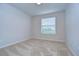 Spacious bedroom with large window and carpet at 20131 Nob Oak Ave, Tampa, FL 33647