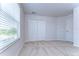 Bright bedroom featuring neutral walls, carpet flooring, and a window with blinds at 20131 Nob Oak Ave, Tampa, FL 33647