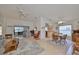 Open living and dining area with tile floors and ceiling fans at 812 Mccallister Ave, Sun City Center, FL 33573