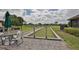 Community bocce ball courts with seating area at 812 Mccallister Ave, Sun City Center, FL 33573