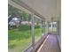 Relaxing screened porch overlooking the backyard at 812 Mccallister Ave, Sun City Center, FL 33573