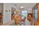 Open dining room with kitchen views and a wooden table at 812 Mccallister Ave, Sun City Center, FL 33573